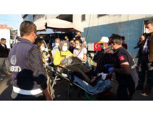 Pazar alışverişi sırasında silahlı kavganın arasında kalan kadın ayağından yaralandı